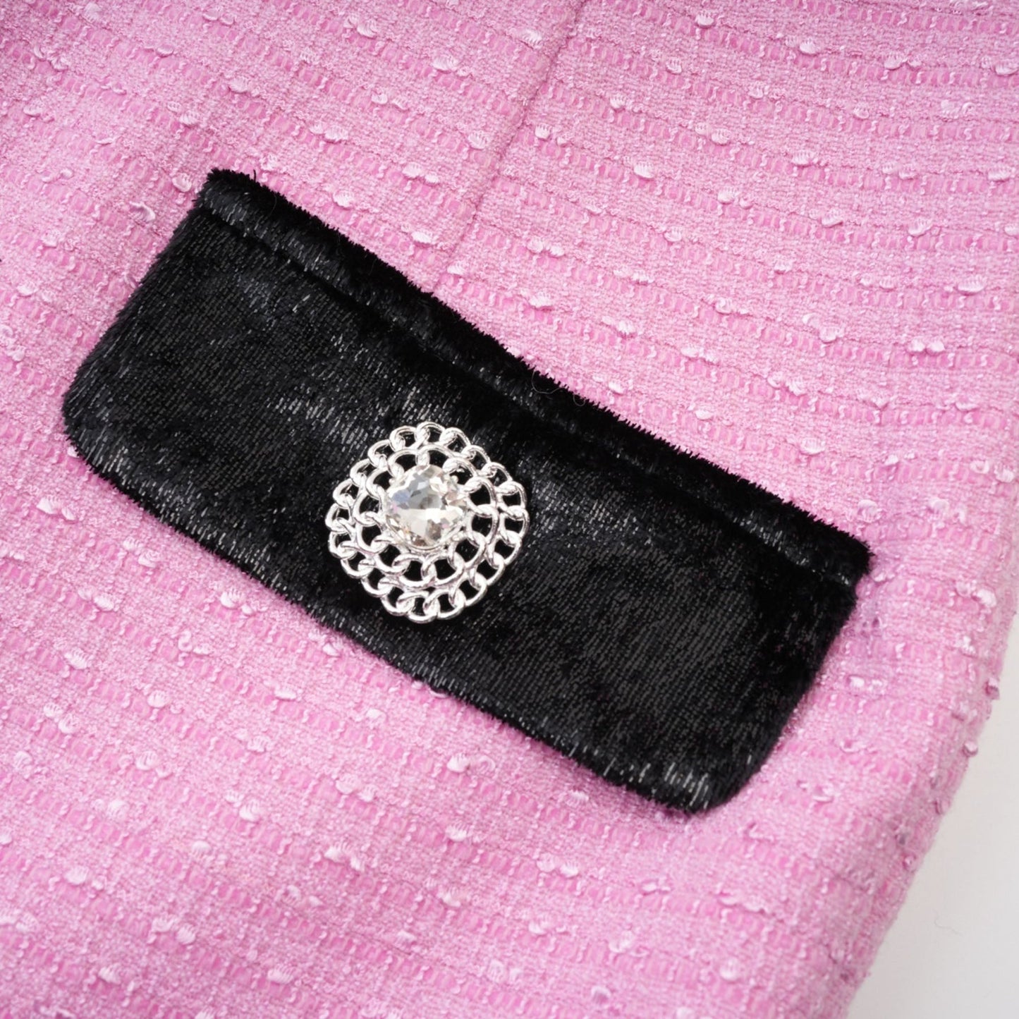 Pink jacket with fulllength sleeves Vshaped collar and button closures made of 80% Polyester 20% Cotton