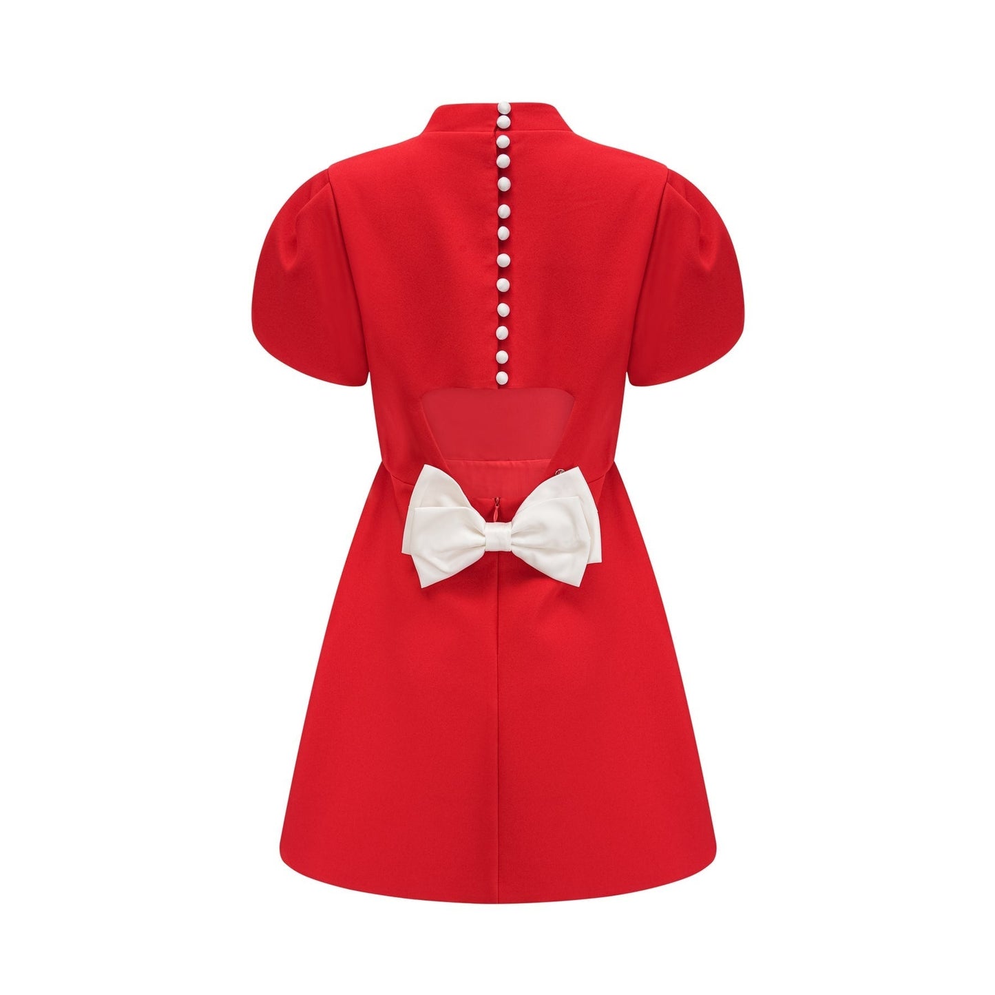 Woman wearing red mini dress with petal sleeves cut out details and bow accent