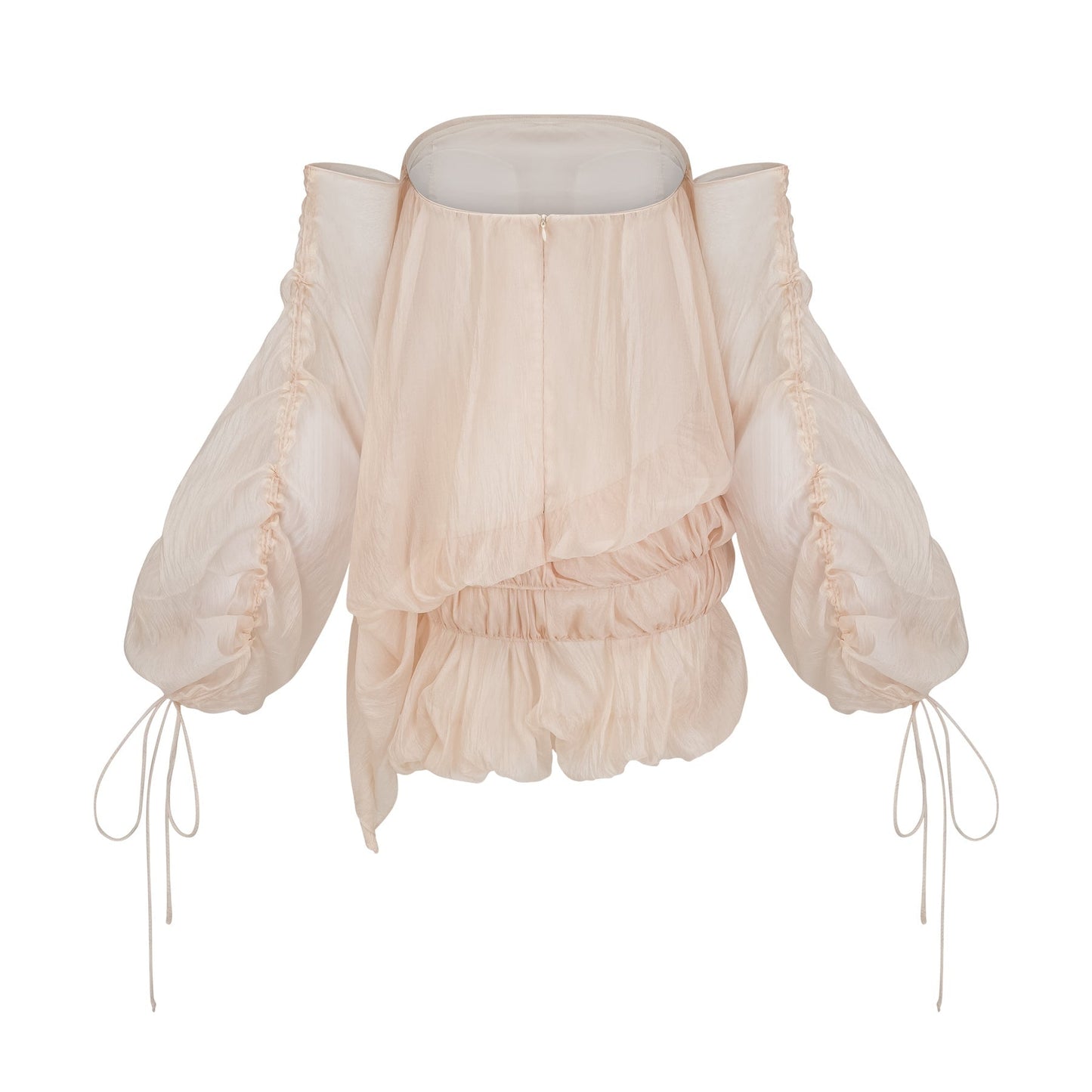 Woman wearing short white layered dress with off shoulder design and ruched fabric tied at waist