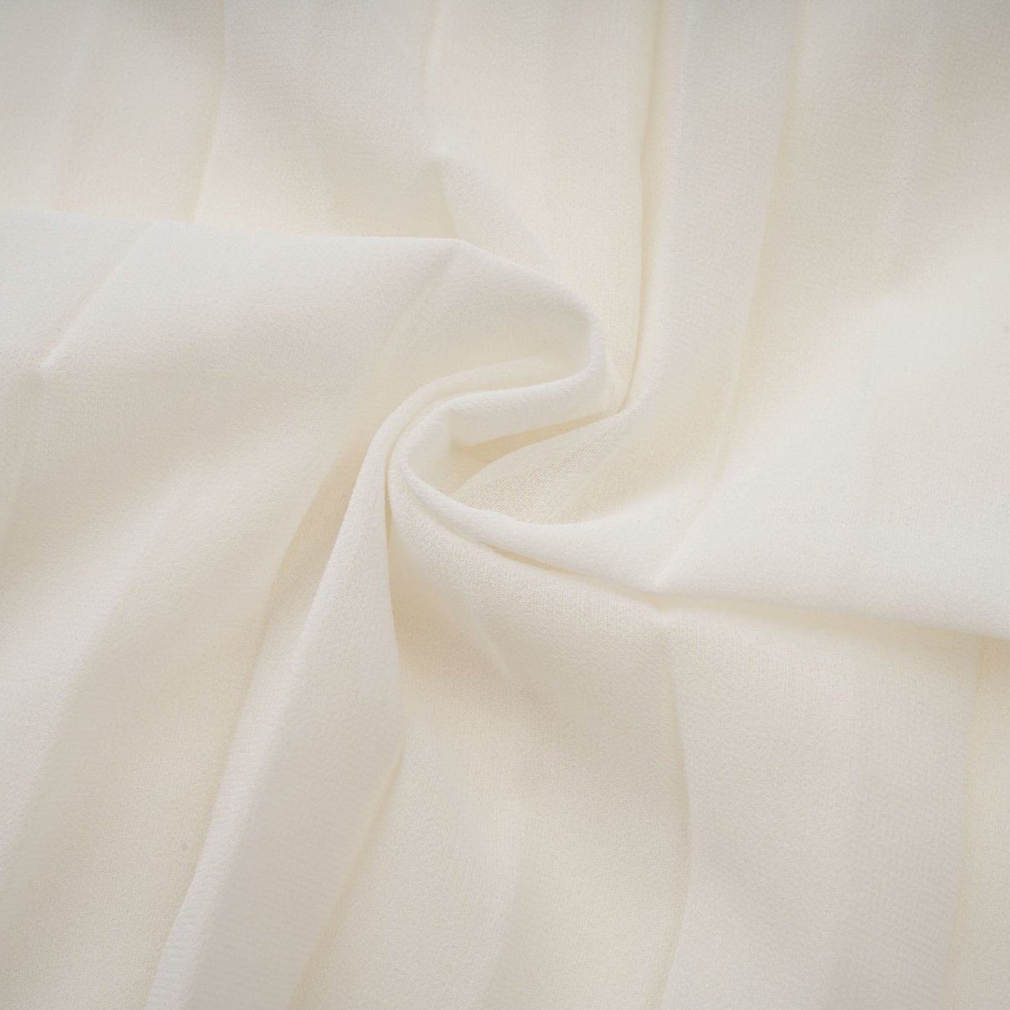 Woman wearing white pleated jacket and dress set with embellishments Blanche collection