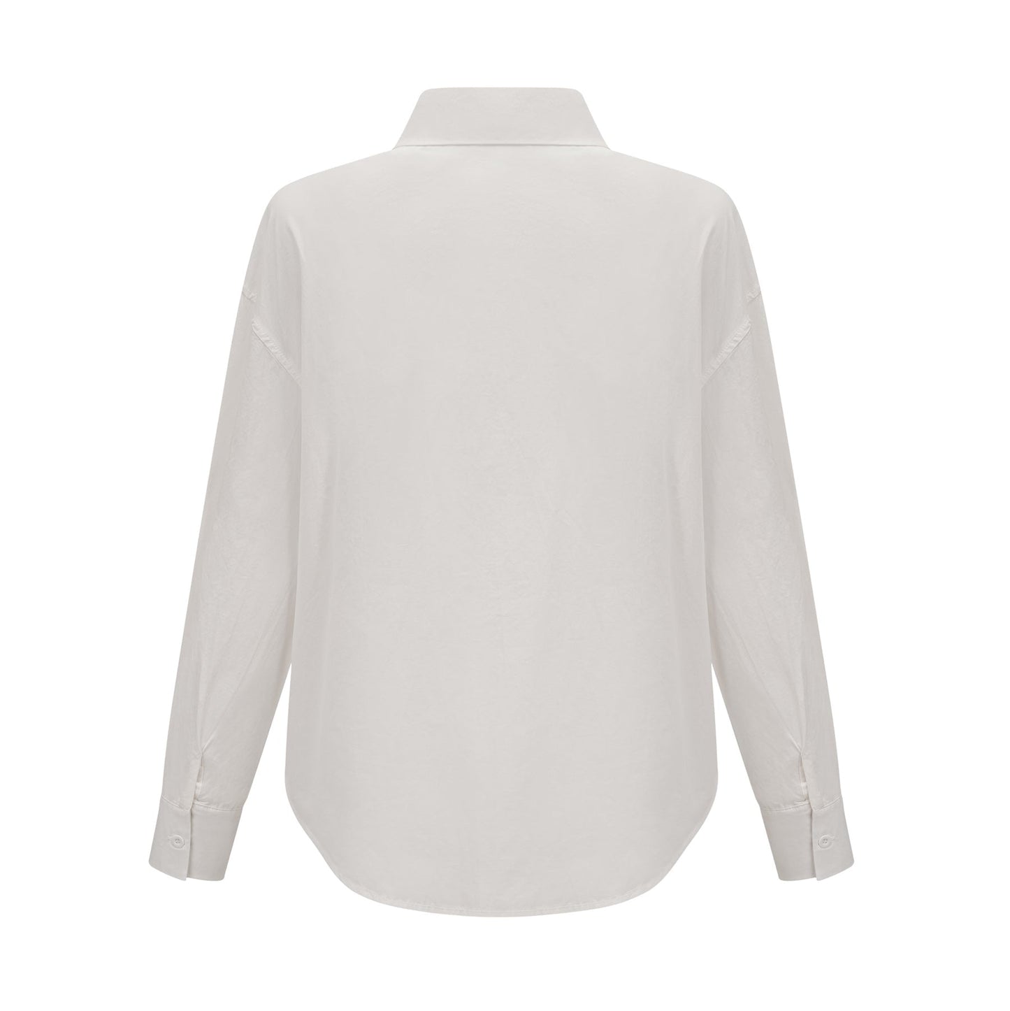 Woman wearing white shirt with floral pattern and cutout details