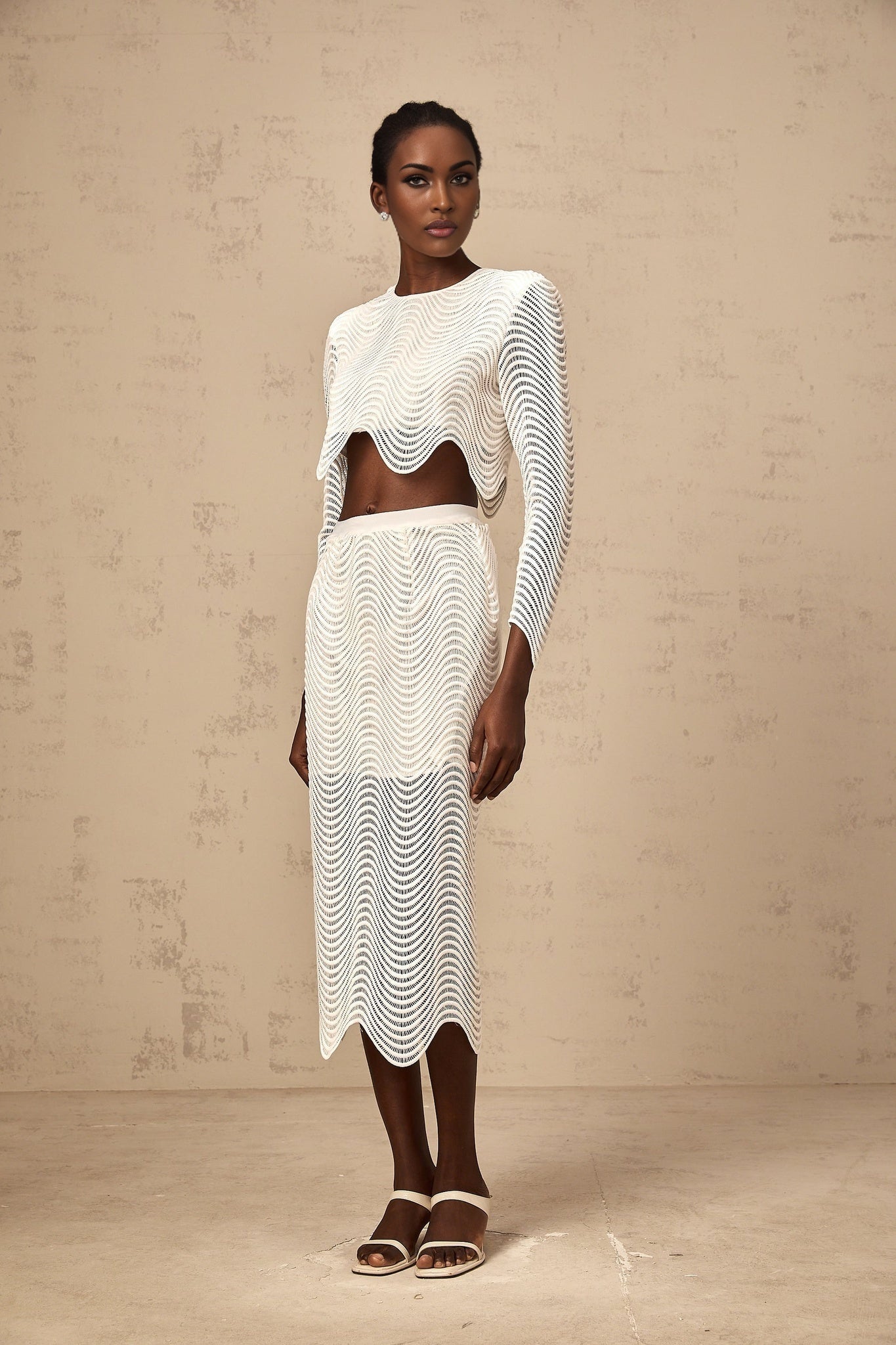 Woman wearing white wavy woven matching top and skirt set named Constance