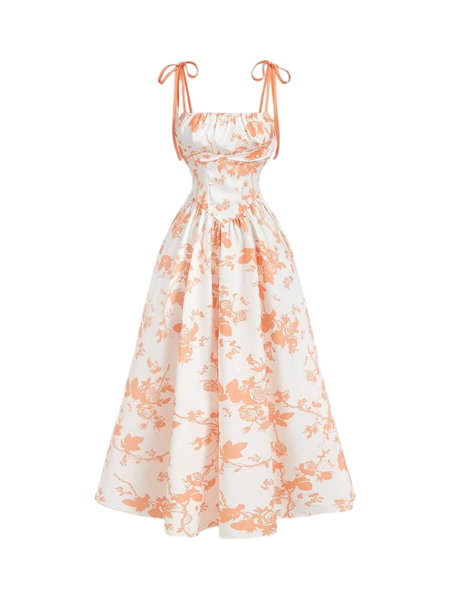 White and orange floral print maxi dress with tie straps and a flowy A-line silhouette