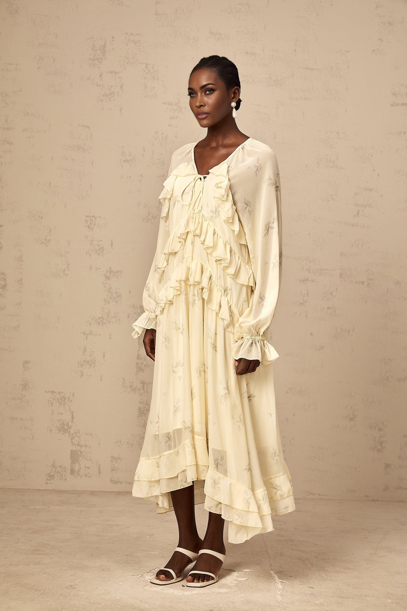 Yellow floral print midi dress with ruffles and chiffon fabric featuring a delicate pattern and feminine design