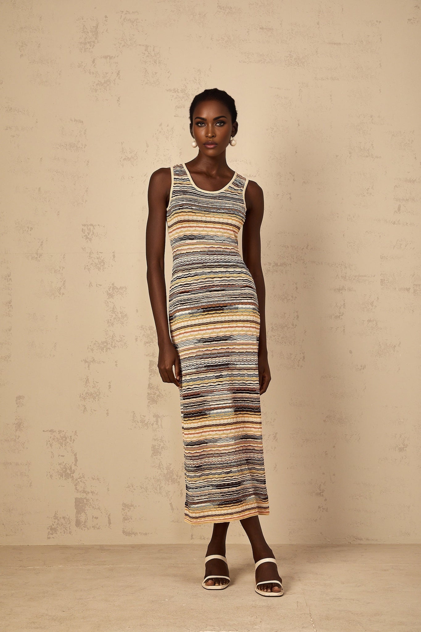 Yellow striped crochet knit midi dress named Quentin with a form fitting silhouette