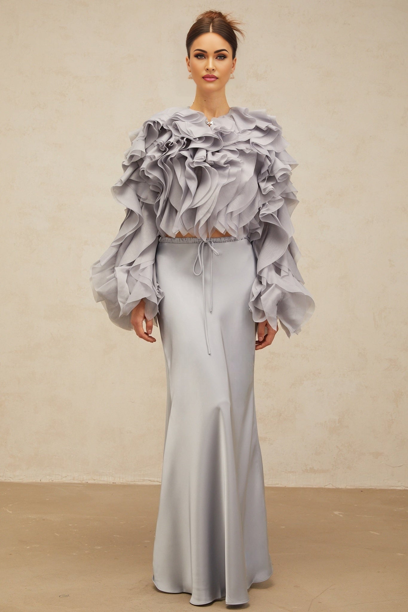 Young girl wearing a haze blue matching set with a ruffled blouse and skirt featuring a bowknot detail inspired by Zelda character design