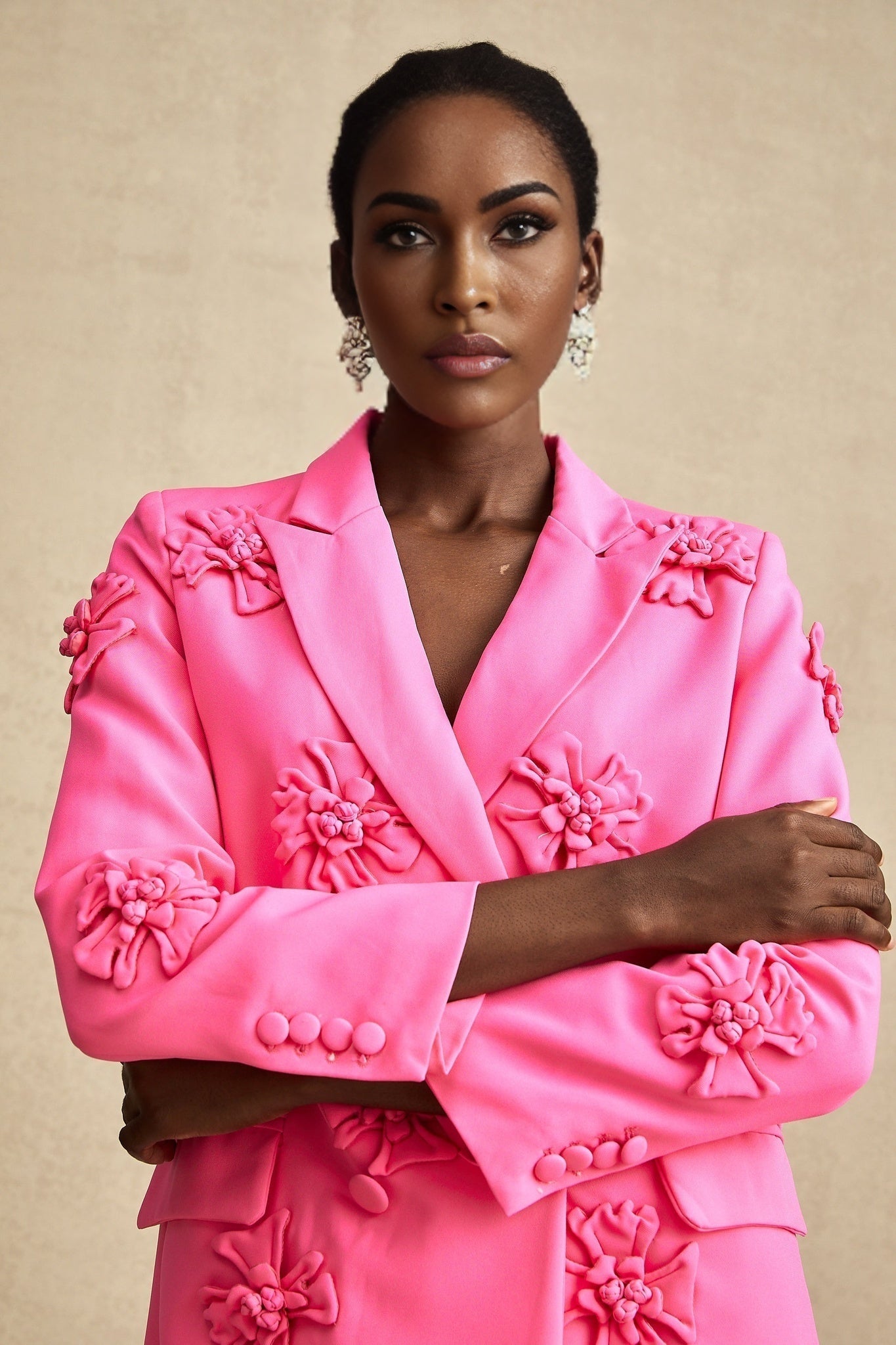 Young girl wearing pink floral jacket and matching trousers set named AmelieRose