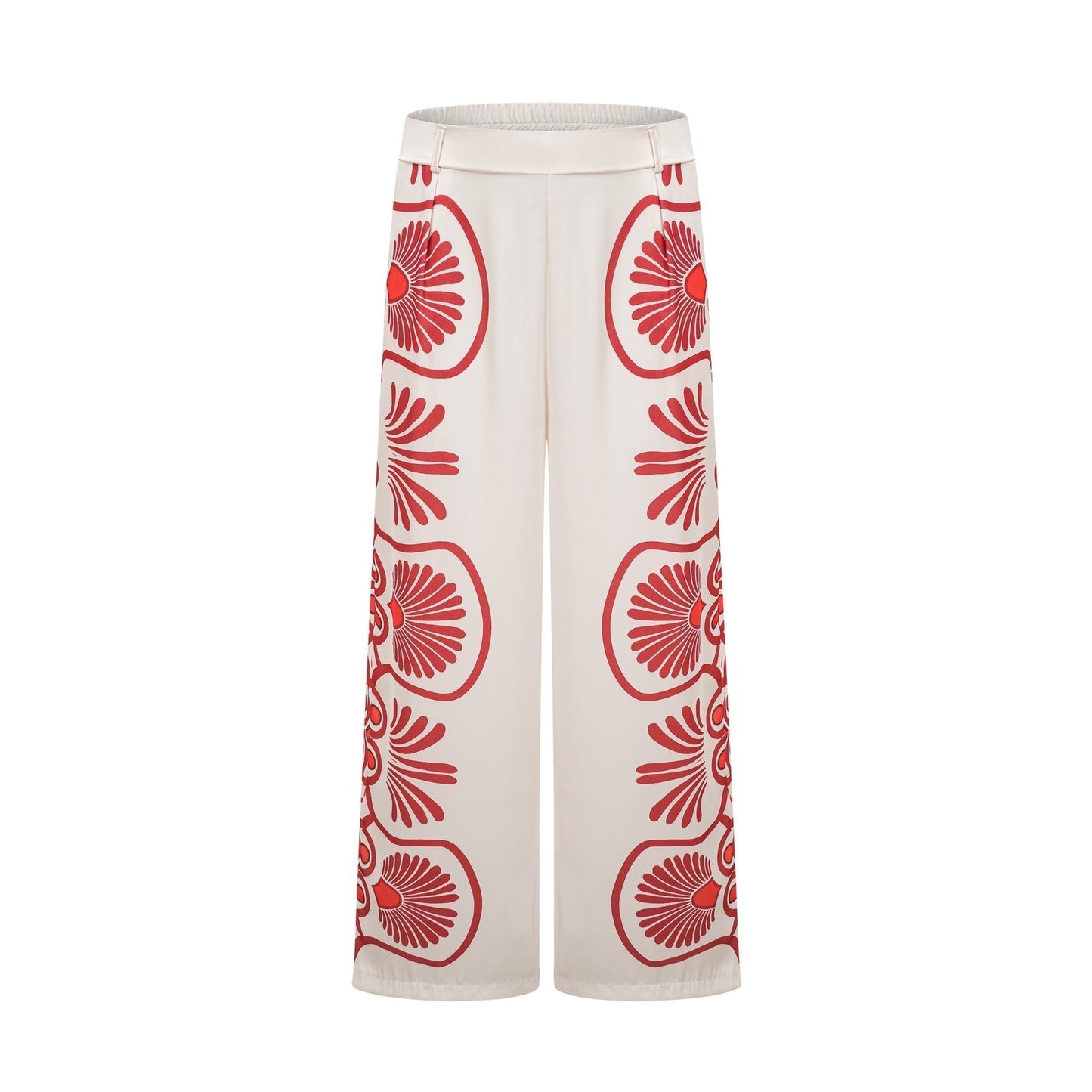 Young woman wearing a matching set consisting of a vibrant graphic print shirt and trousers in bold colors and patterns