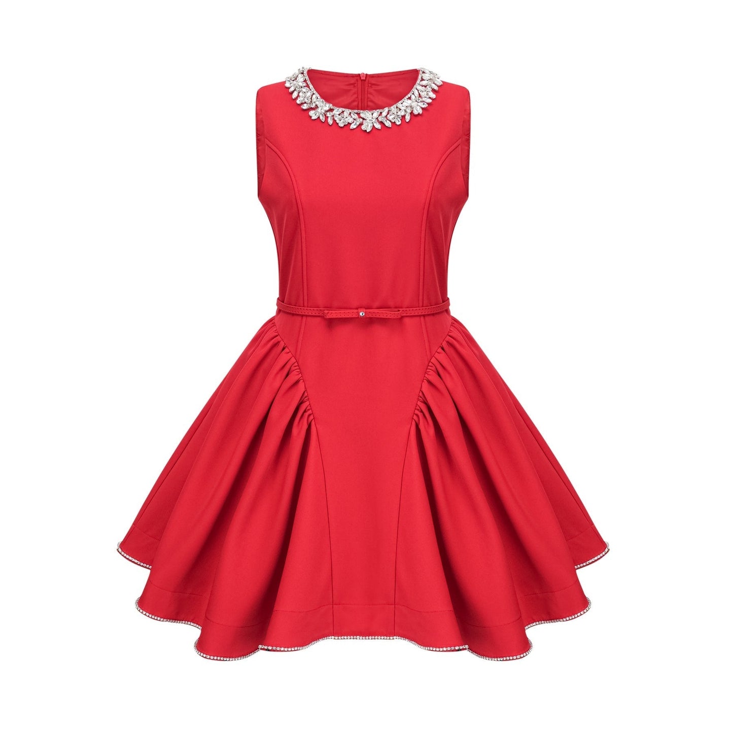 Young woman wearing a short red pleated dress with embellishments standing in a neutral background