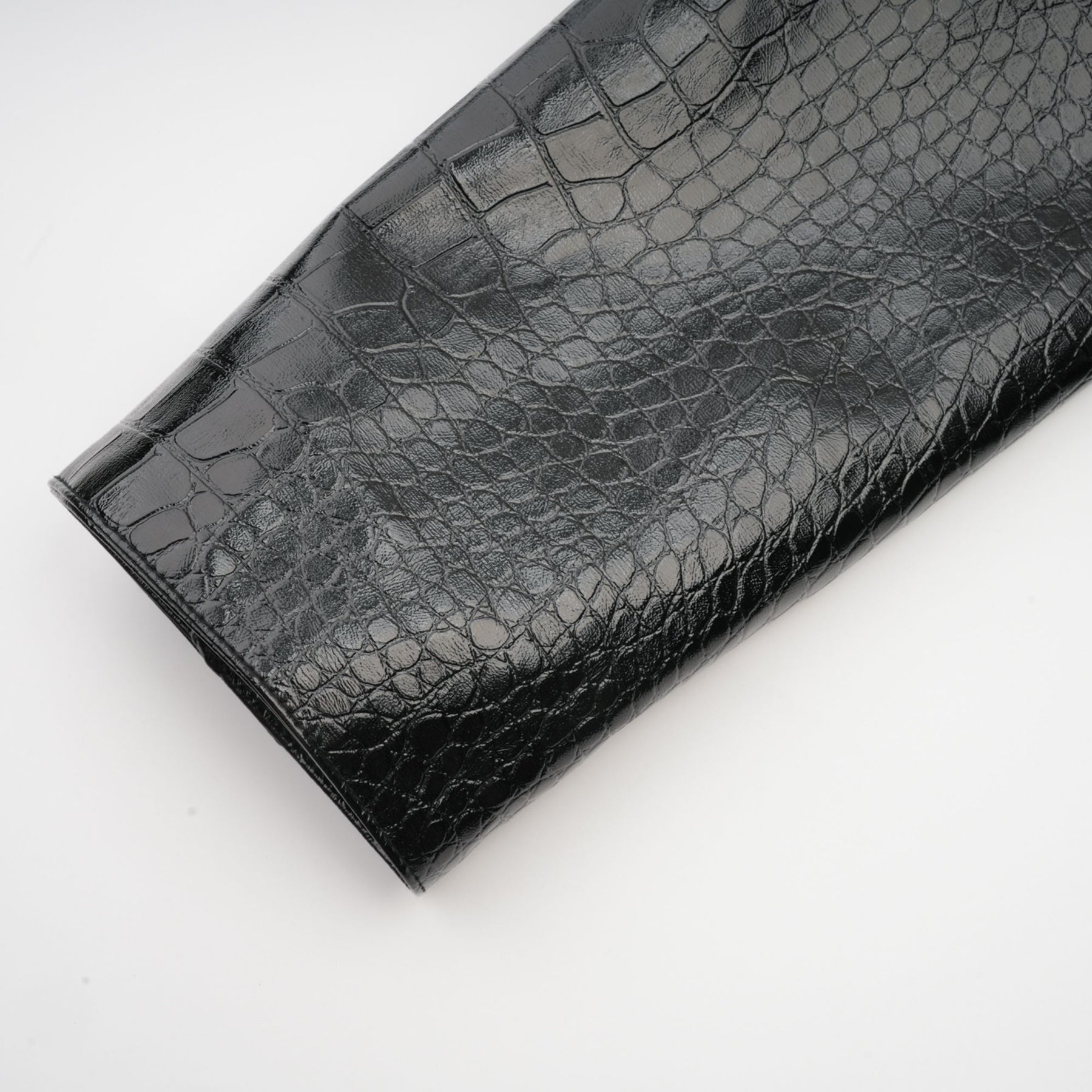 Young woman wearing black leather jacket with cinched waist and zippered front