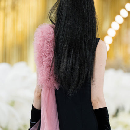 Sophia black dress with a classic A-line silhouette, gold button details, and dramatic pink tulle embellishment, crafted from polyester and nylon.