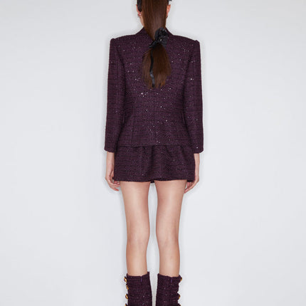 A-line wool-blend mini skirt with shimmer detailing, an elastic waistband, and a flattering high-waisted design. Made from 94.3% polyester, 5.7% wool, and lined with 100% polyester