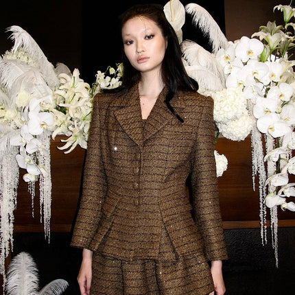 A-line wool-blend mini skirt with shimmer detailing, an elastic waistband, and a flattering high-waisted design. Made from 94.3% polyester, 5.7% wool, and lined with 100% polyester