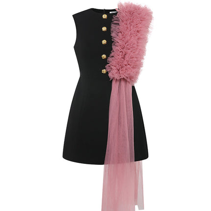 Sophia black dress with a classic A-line silhouette, gold button details, and dramatic pink tulle embellishment, crafted from polyester and nylon.