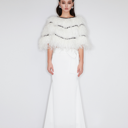 Sophia feather-embellished cape with tiered ostrich feathers, black trim accents, and a relaxed fit, crafted from lightweight polyester.