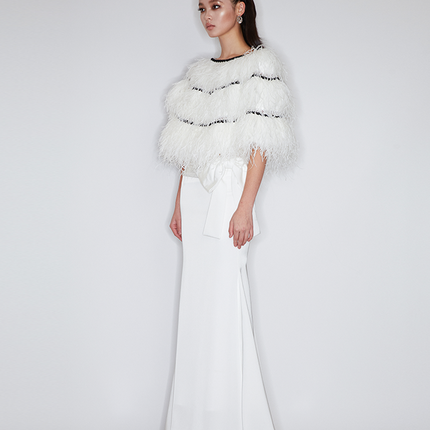 Sophia feather-embellished cape with tiered ostrich feathers, black trim accents, and a relaxed fit, crafted from lightweight polyester.