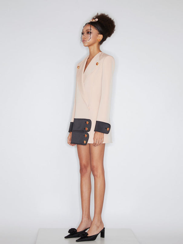 Double-breasted blazer dress with contrast details, decorative buttons, and a tailored fit. Made from 90% polyester, 10% spandex with 96% polyester, 4% spandex accents