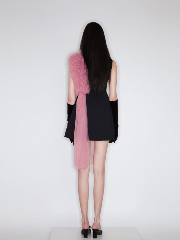 Sophia black dress with a classic A-line silhouette, gold button details, and dramatic pink tulle embellishment, crafted from polyester and nylon.