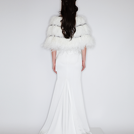 Sophia asymmetric white evening dress with a delicate bow detail, flowing silhouette, and layered hemline, crafted from lightweight polyester.