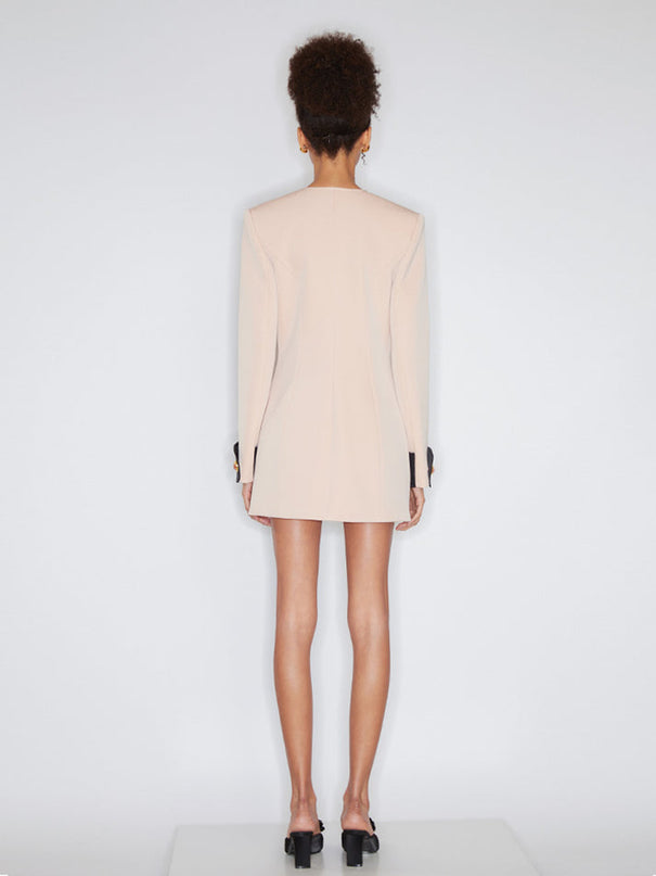 Double-breasted blazer dress with contrast details, decorative buttons, and a tailored fit. Made from 90% polyester, 10% spandex with 96% polyester, 4% spandex accents