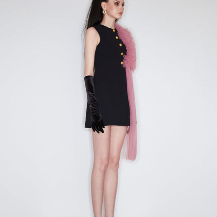 Sophia black dress with a classic A-line silhouette, gold button details, and dramatic pink tulle embellishment, crafted from polyester and nylon.