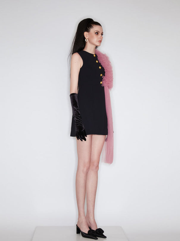 Sophia black dress with a classic A-line silhouette, gold button details, and dramatic pink tulle embellishment, crafted from polyester and nylon.