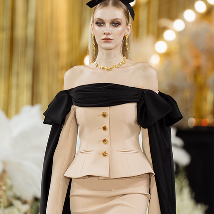 Corset-style top with off-shoulder draped detailing, decorative buttons, and tailored fit. Made from 90% polyester, 10% spandex, and lined with 100% polyester