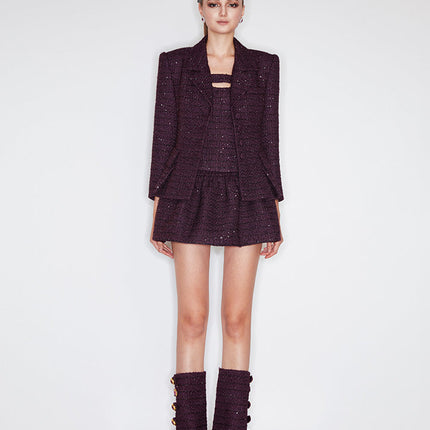 A-line wool-blend mini skirt with shimmer detailing, an elastic waistband, and a flattering high-waisted design. Made from 94.3% polyester, 5.7% wool, and lined with 100% polyester