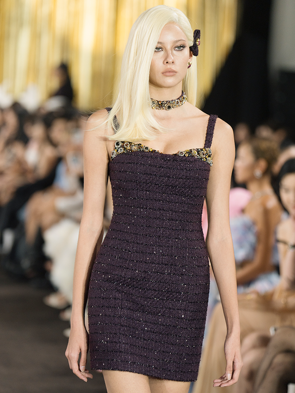 Fitted mini dress with shimmering embellishments, delicate straps, and a structured silhouette. Made from 85% polyester, 15% wool, and lined with 100% polyester