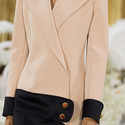 Double-breasted blazer dress with contrast details, decorative buttons, and a tailored fit. Made from 90% polyester, 10% spandex with 96% polyester, 4% spandex accents