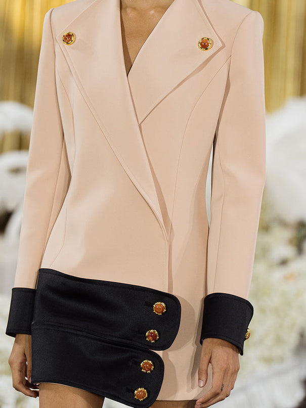 Double-breasted blazer dress with contrast details, decorative buttons, and a tailored fit. Made from 90% polyester, 10% spandex with 96% polyester, 4% spandex accents