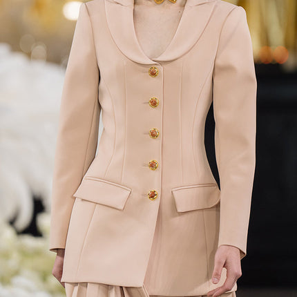 Fitted blazer dress with decorative buttons, tailored silhouette, and flap pockets. Made from 90% polyester, 10% spandex, and lined with 100% polyester