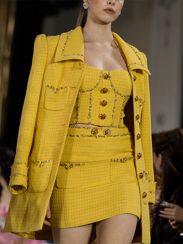 Sophia embellished tweed coat in vibrant yellow with crystal lapels, gemstone buttons, and a fitted mid-thigh silhouette, crafted from 100% polyester.