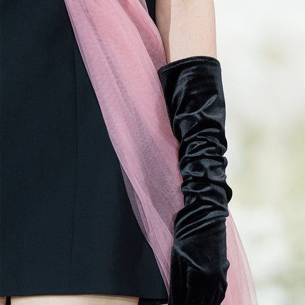 Sophia black dress with a classic A-line silhouette, gold button details, and dramatic pink tulle embellishment, crafted from polyester and nylon.