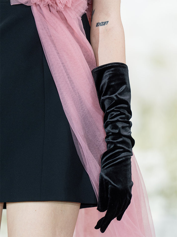 Sophia black dress with a classic A-line silhouette, gold button details, and dramatic pink tulle embellishment, crafted from polyester and nylon.