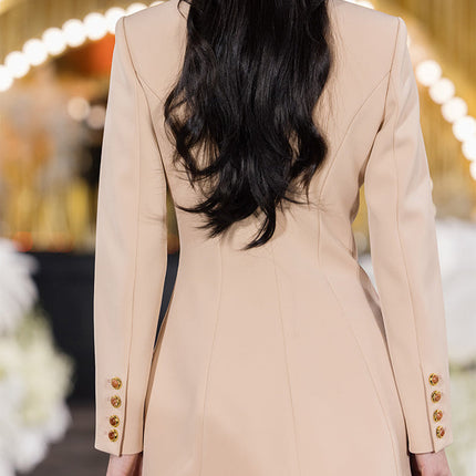 Fitted blazer dress with decorative buttons, tailored silhouette, and flap pockets. Made from 90% polyester, 10% spandex, and lined with 100% polyester