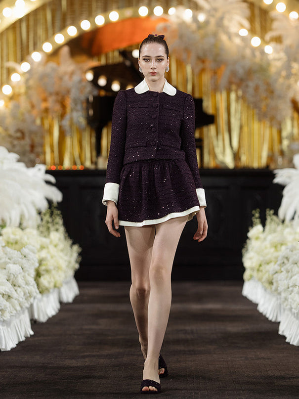 Classic cropped tweed jacket with contrasting collar and cuffs for a refined finish