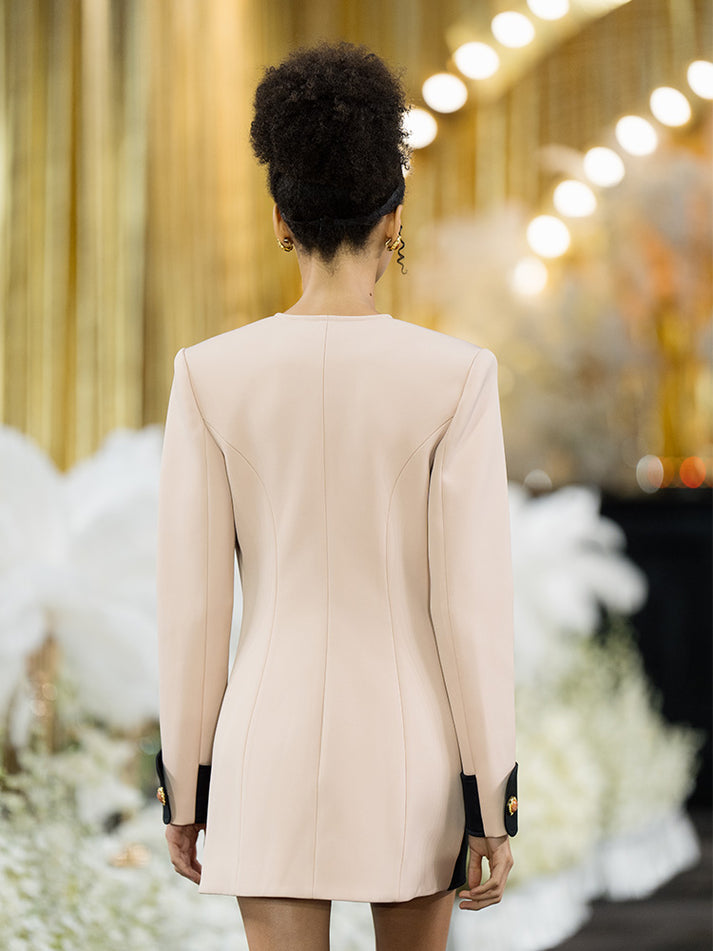 Double-breasted blazer dress with contrast details, decorative buttons, and a tailored fit. Made from 90% polyester, 10% spandex with 96% polyester, 4% spandex accents