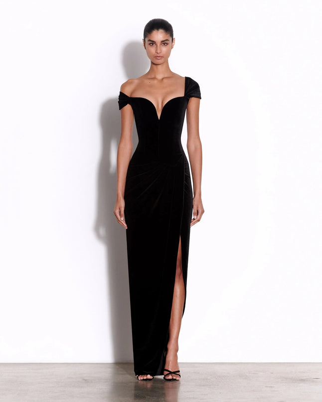 Skye wearing 2025 Black Dress with Timeless Elegance by Alex Perry floor-length dress in Italy, strapless silhouette, natural waistline, sheath style, solid pattern, lightweight stretch fabric, stand neckline, sleeveless style, high street chic