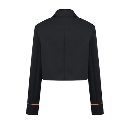 Cropped jacket with a tailored design, featuring dual front pockets, elegant trims, and made from 60% cotton, 40% polyester, with a 100% polyester lining.