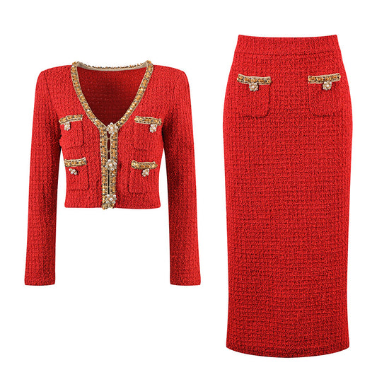 Elegant red tweed jacket with gold embellishments paired with a matching midi skirt, ideal for formal occasions