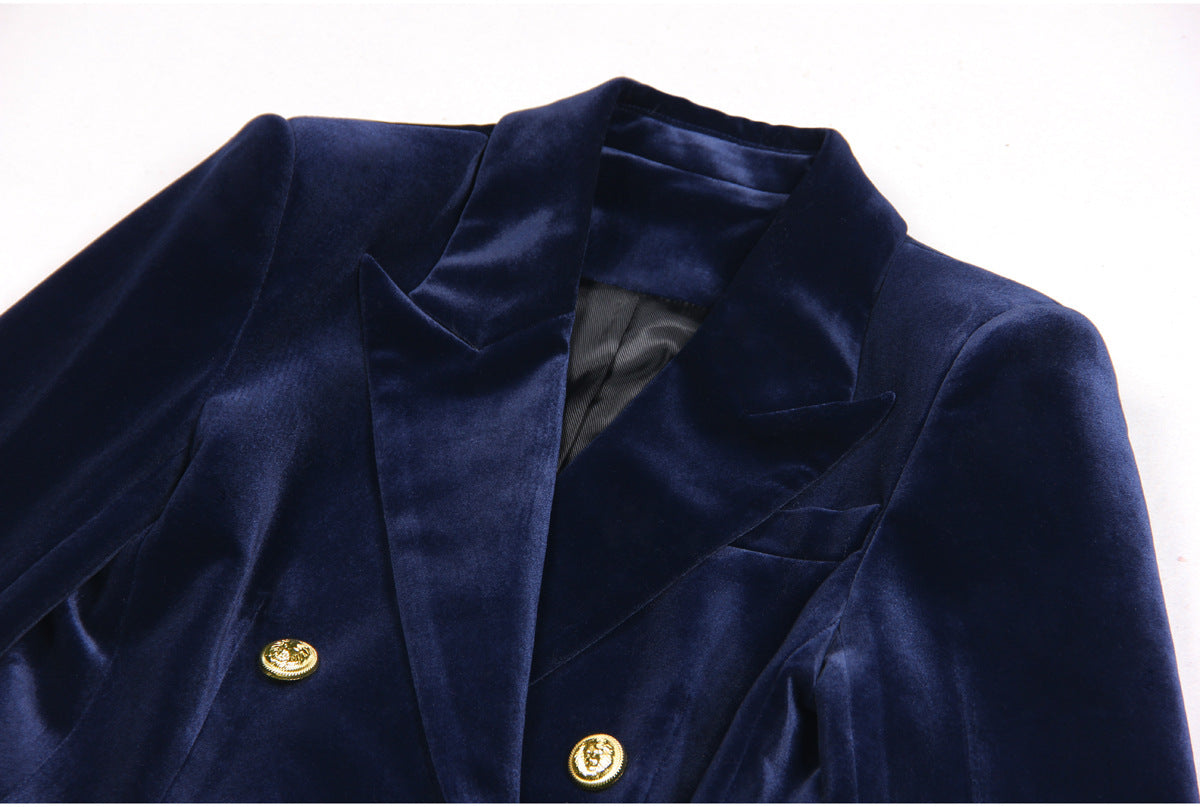 Navy blue velvet suit with a double-breasted blazer featuring gold buttons and matching flared trousers