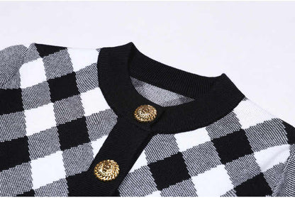 Elegant black and white argyle-patterned knit cardigan with gold button details