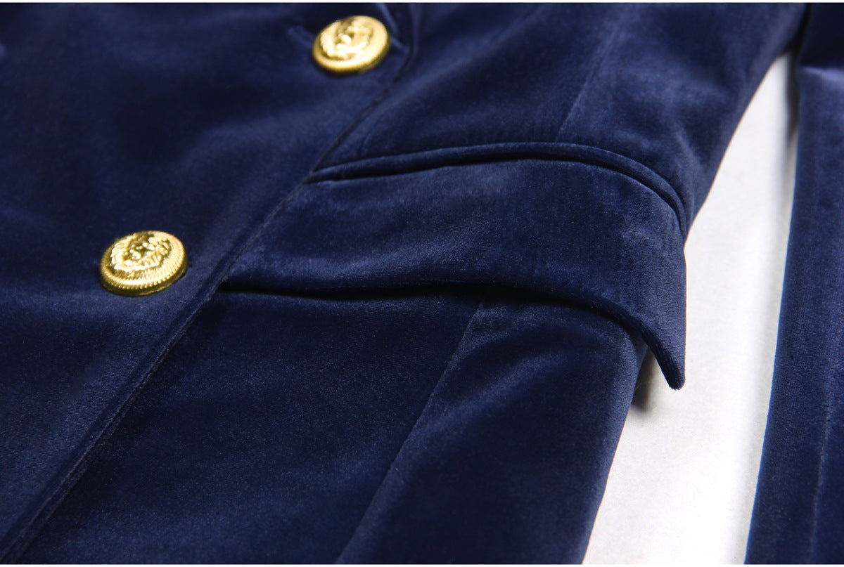 Navy blue velvet suit with a double-breasted blazer featuring gold buttons and matching flared trousers