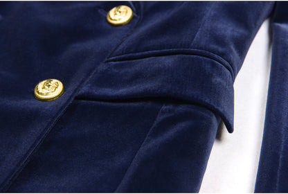 Navy blue velvet suit with a double-breasted blazer featuring gold buttons and matching flared trousers
