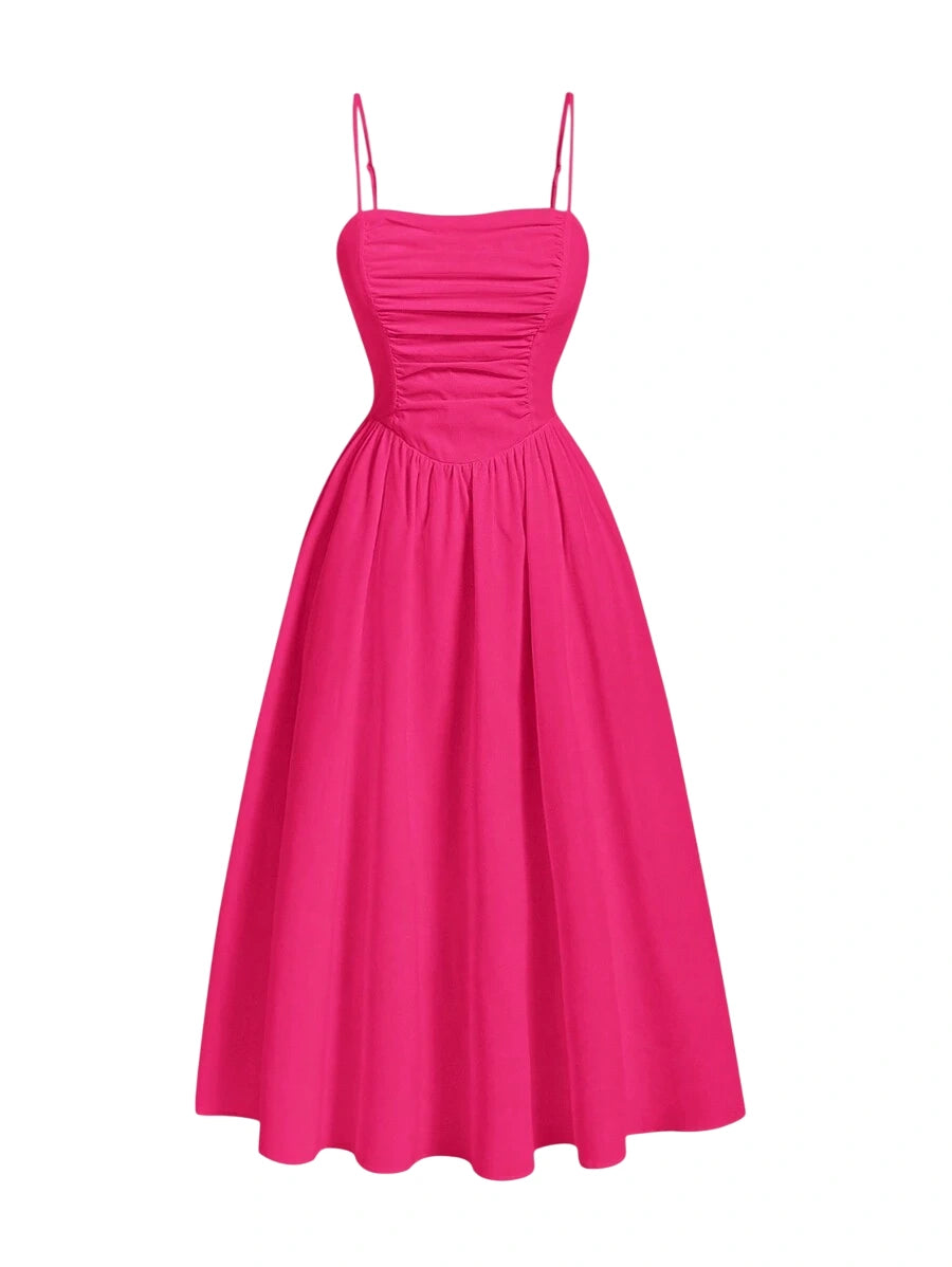 Hot pink ruched maxi dress with spaghetti straps and a flowing silhouette for a chic and flattering style