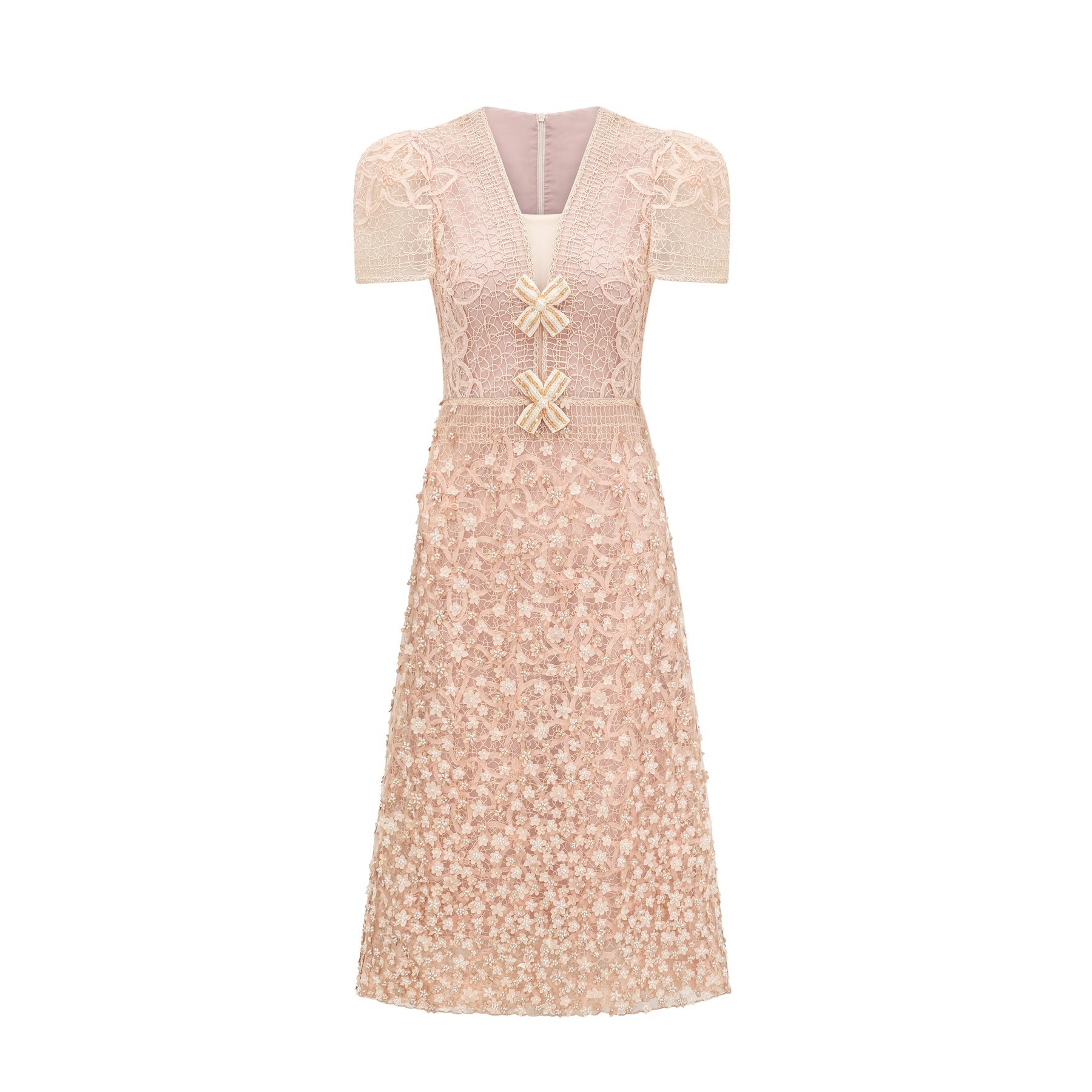 A beige midi dress with crochet detailing and faux flower embellishments in neutral tones