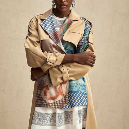 A belted trench coat in contrasting colors featuring a printed design named Josephine