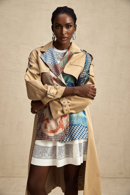 A belted trench coat in contrasting colors featuring a printed design named Josephine