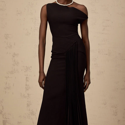 A black asymmetric draped midi dress with a flowing silhouette and an uneven hemline